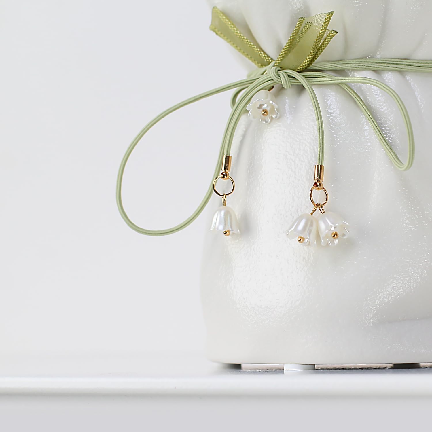 White Ceramic Vase with Ribbon Tie and Pendants